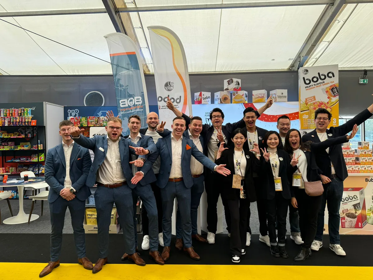 The BOB Distribution team cheering in front of the stand at SIAL Paris.